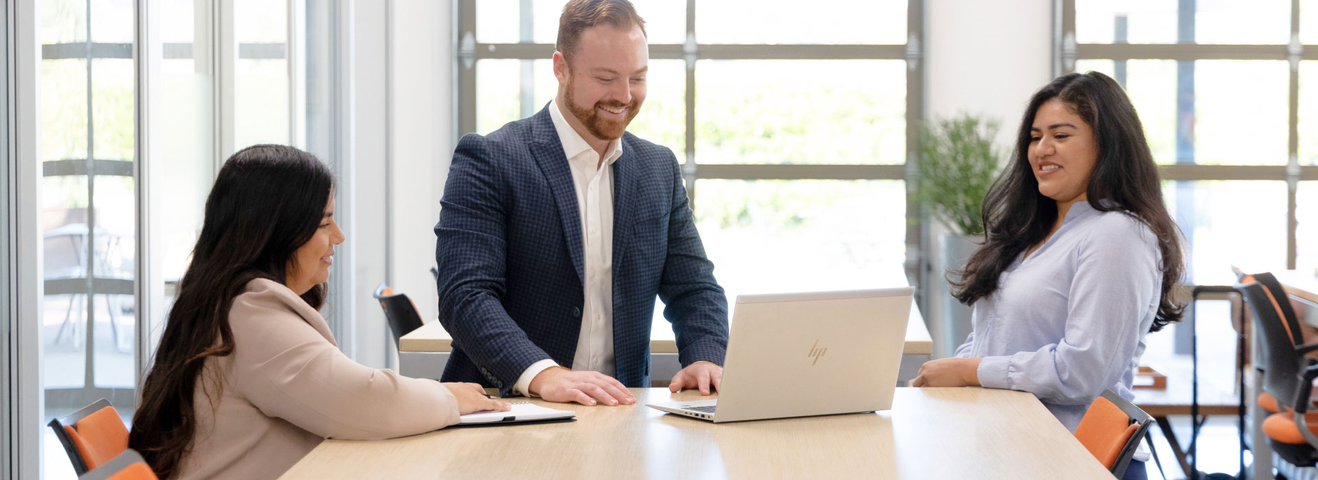 Relational Advisors working around a laptop