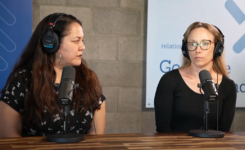 Vannessa Ruiz and Kristin Conti sitting in front of microphones in a podcast studio.
